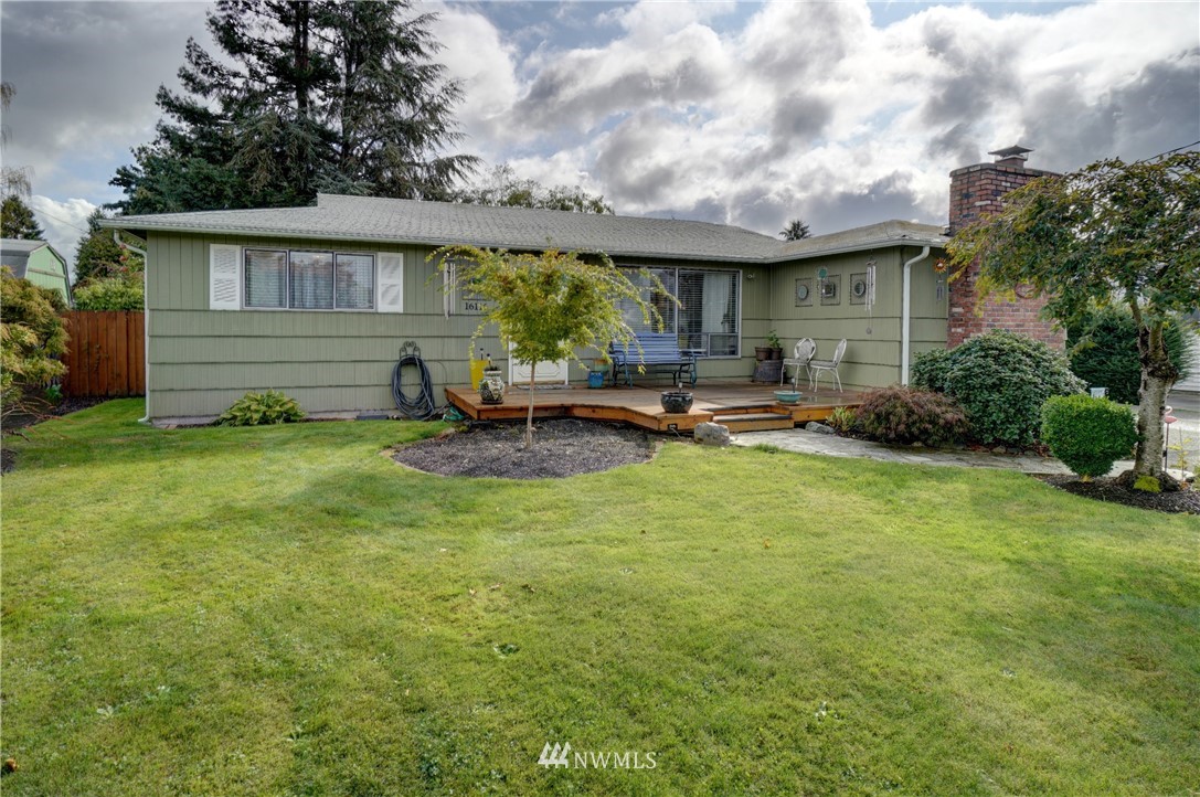16116 119th Avenue Southeast Renton, WA 98058 - Photo 2 of 20 a view of a house with backyard sitting area and garden