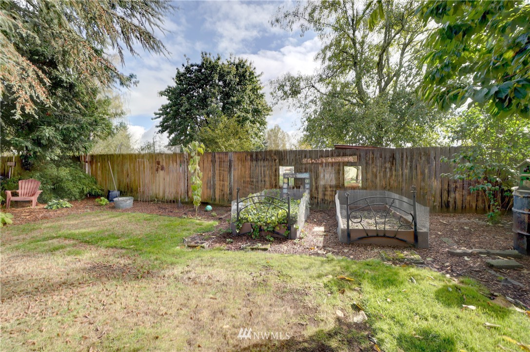 16116 119th Avenue Southeast Renton, WA 98058 - Photo 16 of 20 a backyard of a house with barbeque oven