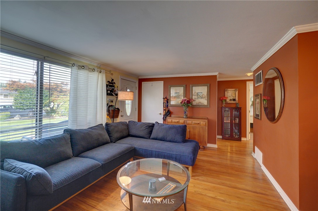 16116 119th Avenue Southeast Renton, WA 98058 - Photo 3 of 20 a living room with furniture and a large window