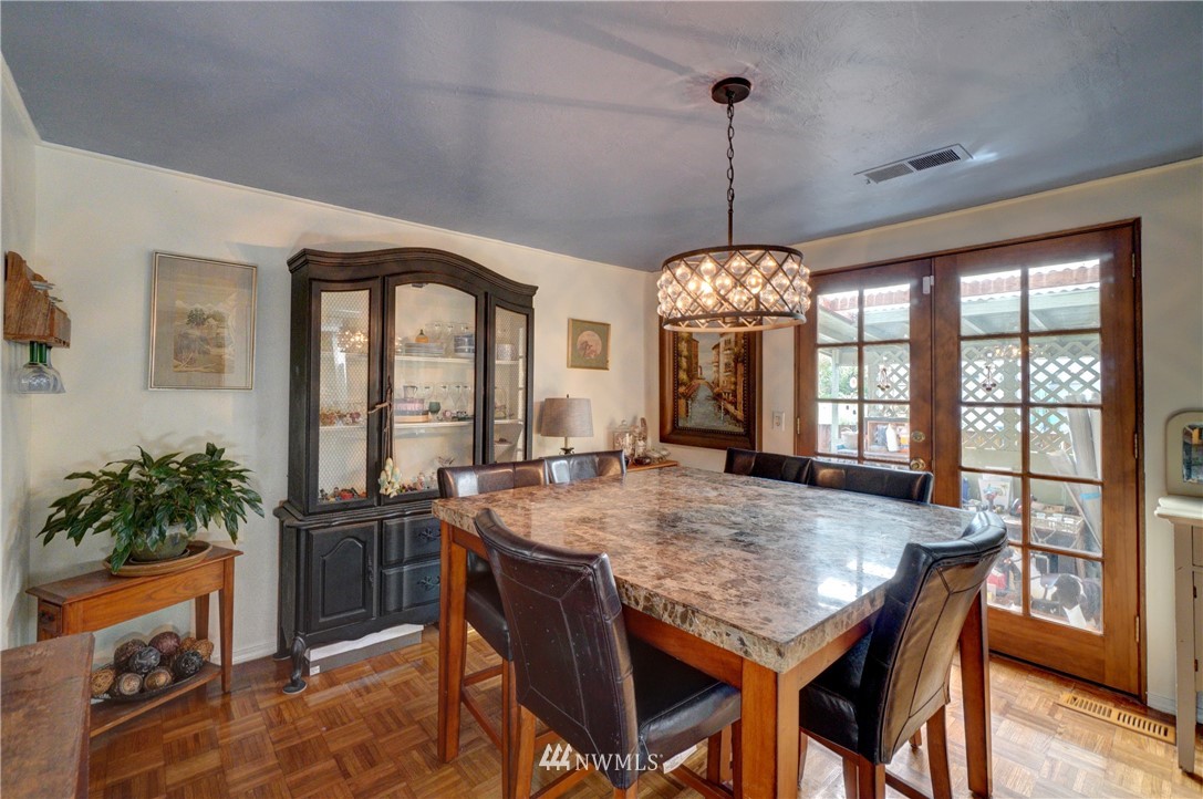 16116 119th Avenue Southeast Renton, WA 98058 - Photo 5 of 20 a dining room with furniture window and wooden floor