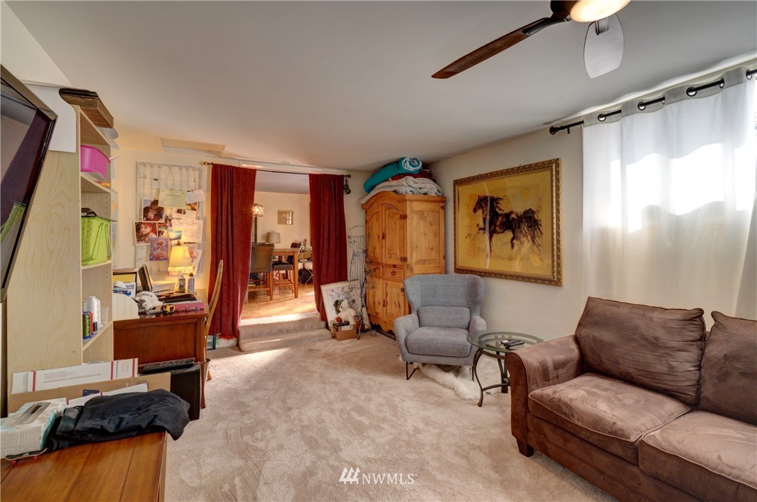 16116 119th Avenue Southeast Renton, WA 98058 - Photo 10 of 20 a living room with furniture and a flat screen tv