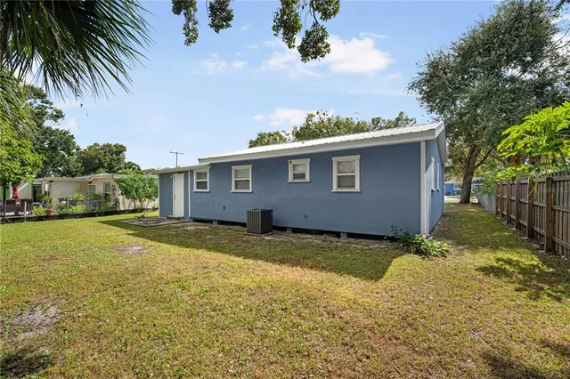 a view of a house with a yard and garage