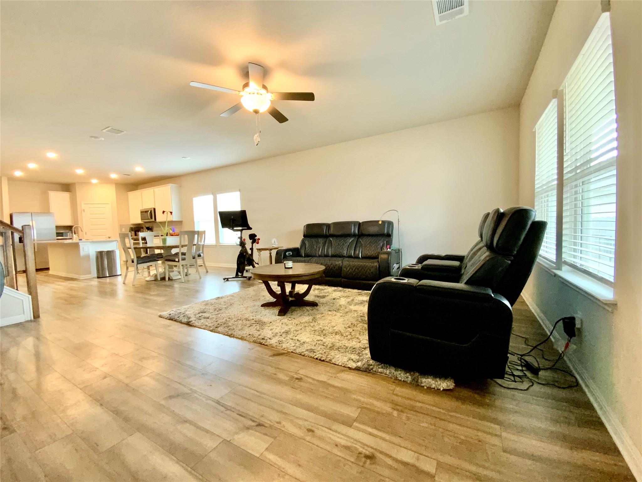246 El Capitan Loop Dripping Springs, TX 78620 - Photo 17 of 37 Living room featuring ceiling fan and light wood finished floors