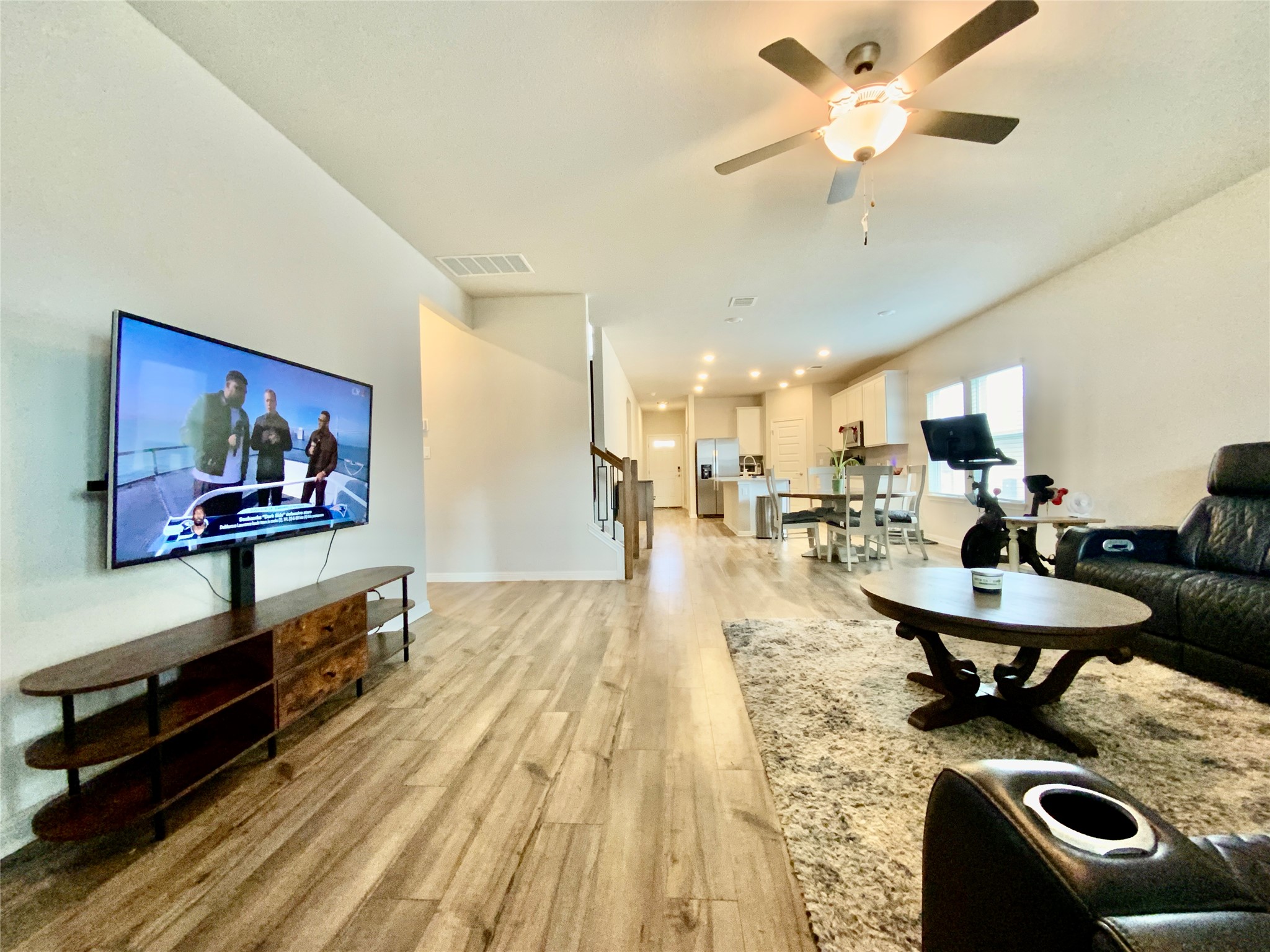 246 El Capitan Loop Dripping Springs, TX 78620 - Photo 18 of 37 Living area featuring light wood-style flooring and ceiling fan