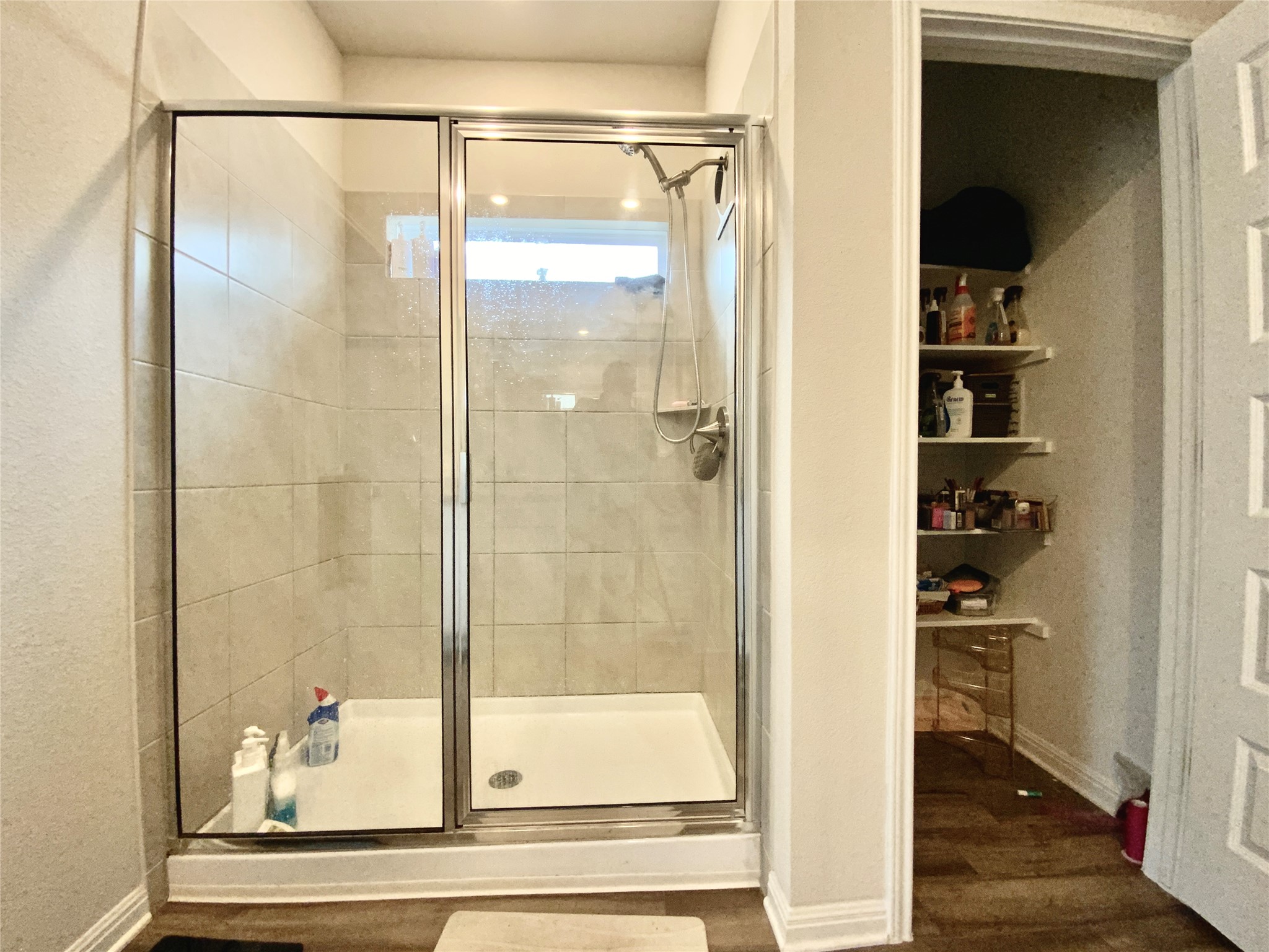 246 El Capitan Loop Dripping Springs, TX 78620 - Photo 24 of 37 Full bath featuring a stall shower and dark wood-type flooring