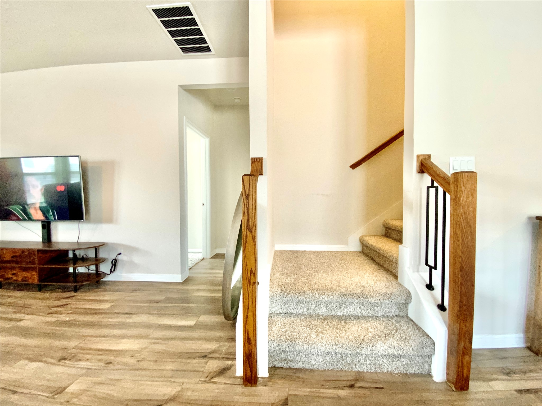 246 El Capitan Loop Dripping Springs, TX 78620 - Photo 25 of 37 Staircase with wood finished floors and baseboards