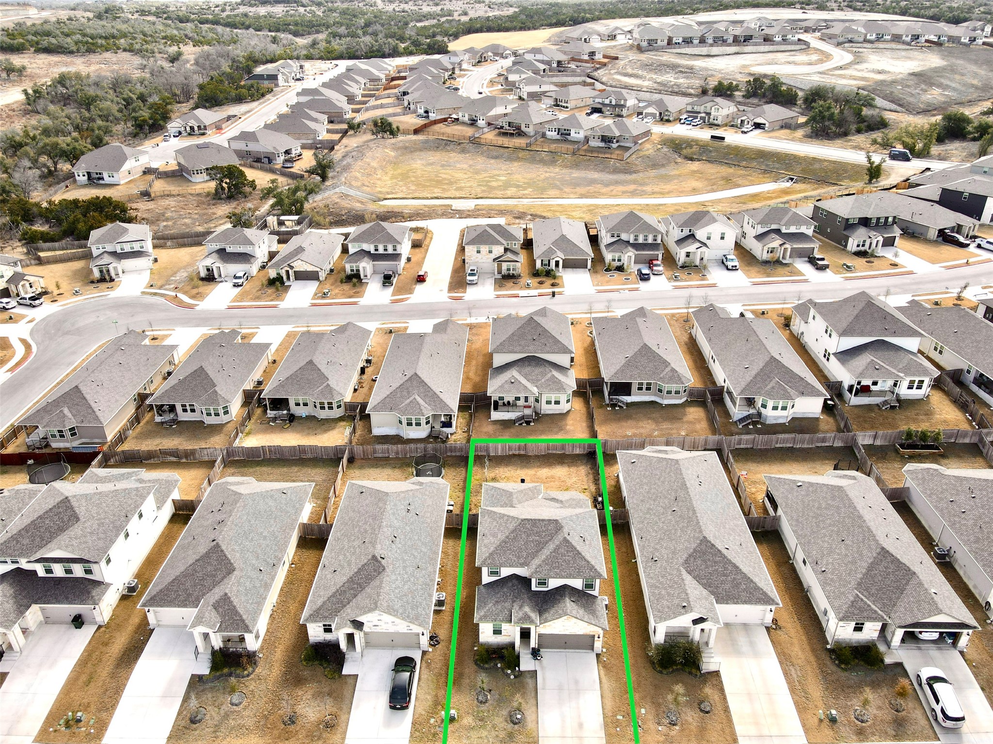 246 El Capitan Loop Dripping Springs, TX 78620 - Photo 36 of 37 Aerial view of residential area featuring property boundaries highlighted