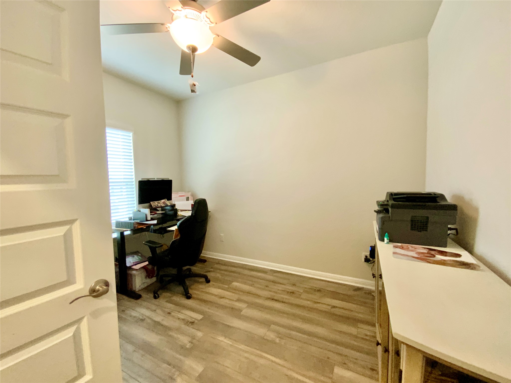 246 El Capitan Loop Dripping Springs, TX 78620 - Photo 6 of 37 Office with light wood-style floors and a ceiling fan