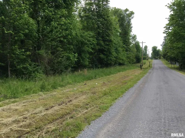 a view of a lake with a yard