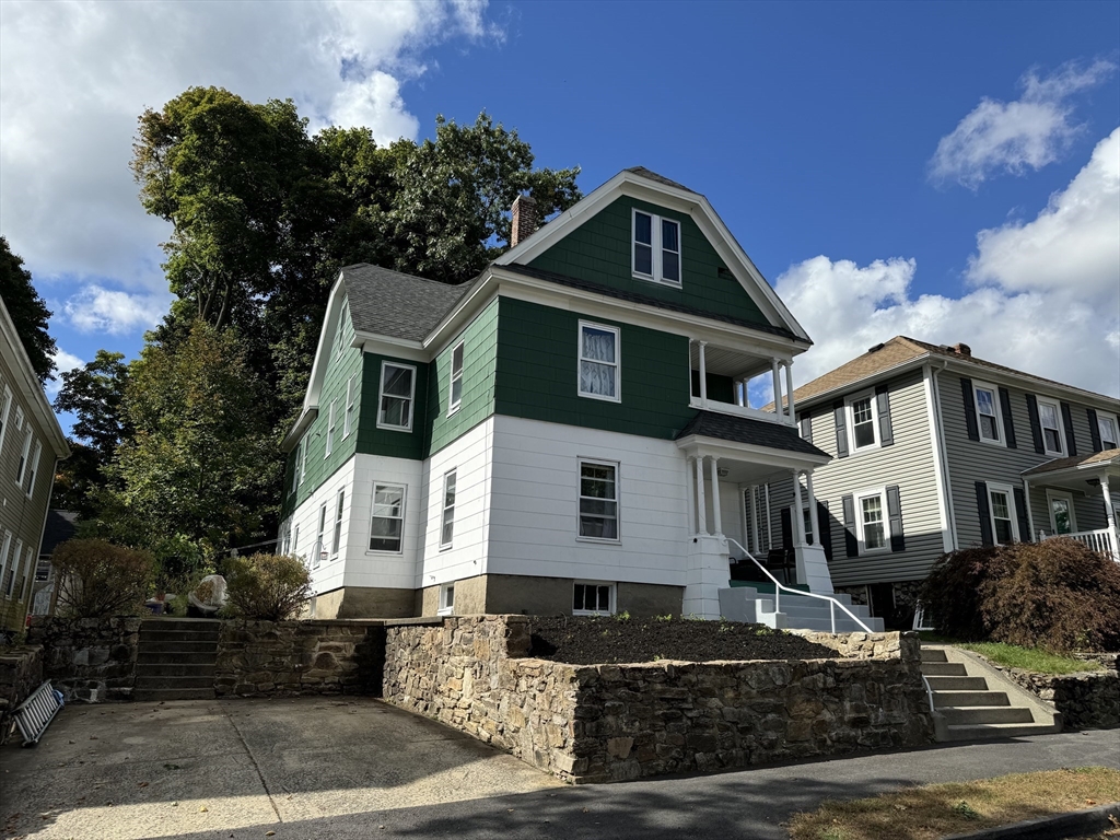 8 Eureka Street Worcester, MA 01603 - Photo 1 of 25 a front view of a house with a yard
