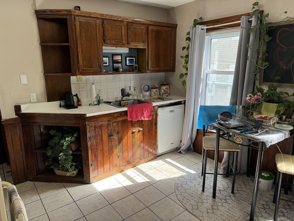 8 Eureka Street Worcester, MA 01603 - Photo 14 of 25 a kitchen with a stove and a refrigerator