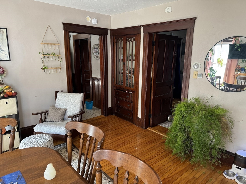 8 Eureka Street Worcester, MA 01603 - Photo 5 of 25 a bedroom with a bed and a mirror