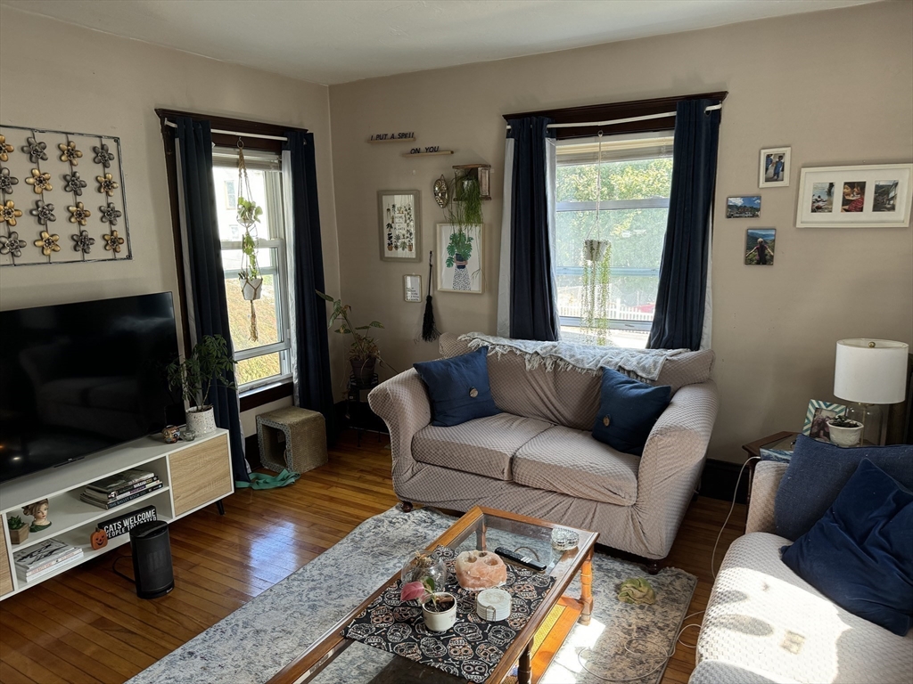 8 Eureka Street Worcester, MA 01603 - Photo 8 of 25 a living room with furniture and a flat screen tv