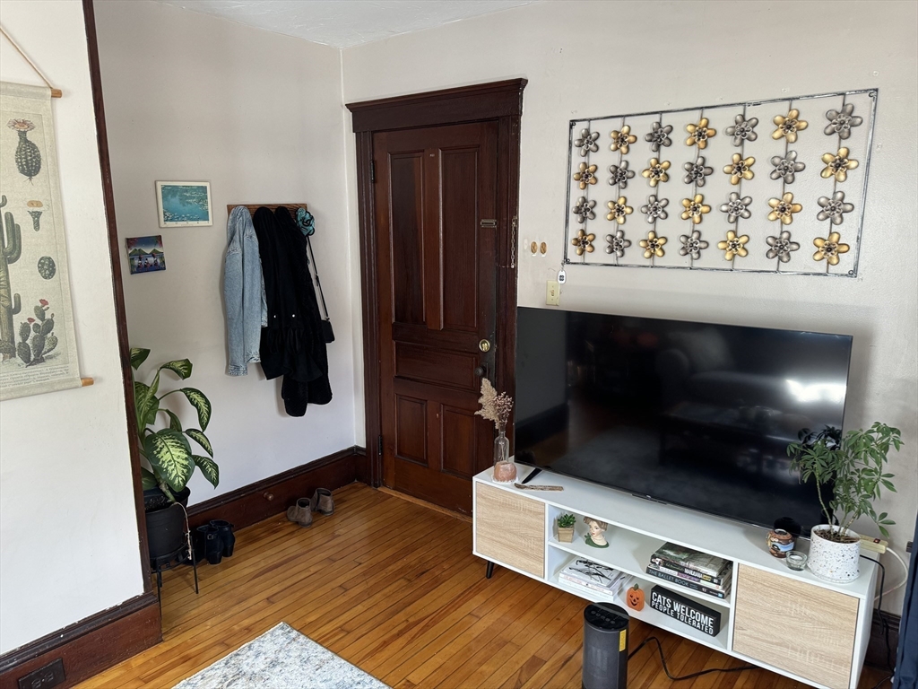 8 Eureka Street Worcester, MA 01603 - Photo 9 of 25 a living room with furniture and a flat screen tv