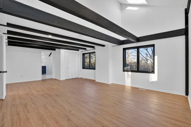 a bathroom with a sink a mirror and a shower