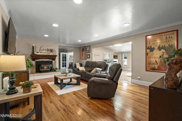 a kitchen with stainless steel appliances granite countertop sink stove and wooden cabinets