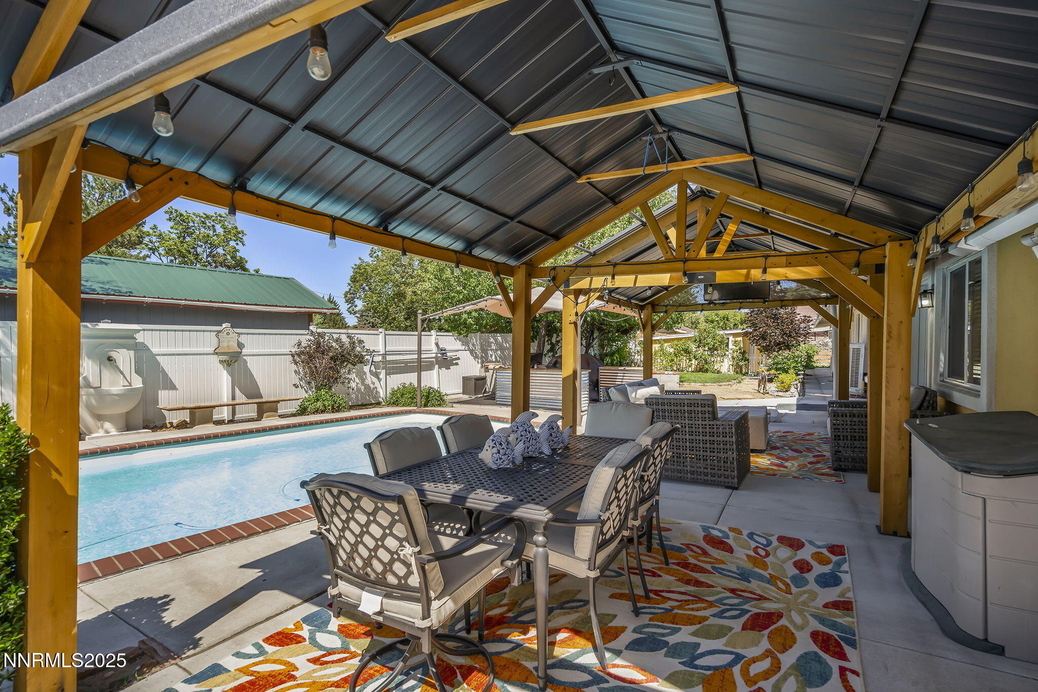 2195 West Plumb Lane Reno, NV 89509 - Photo 23 of 27 a view of an outdoor dining space with a table and chairs