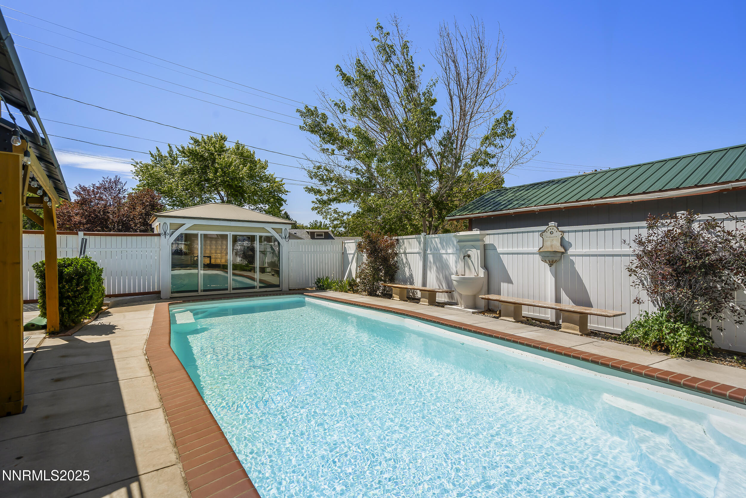 2195 West Plumb Lane Reno, NV 89509 - Photo 26 of 27 a front view of a house with garden