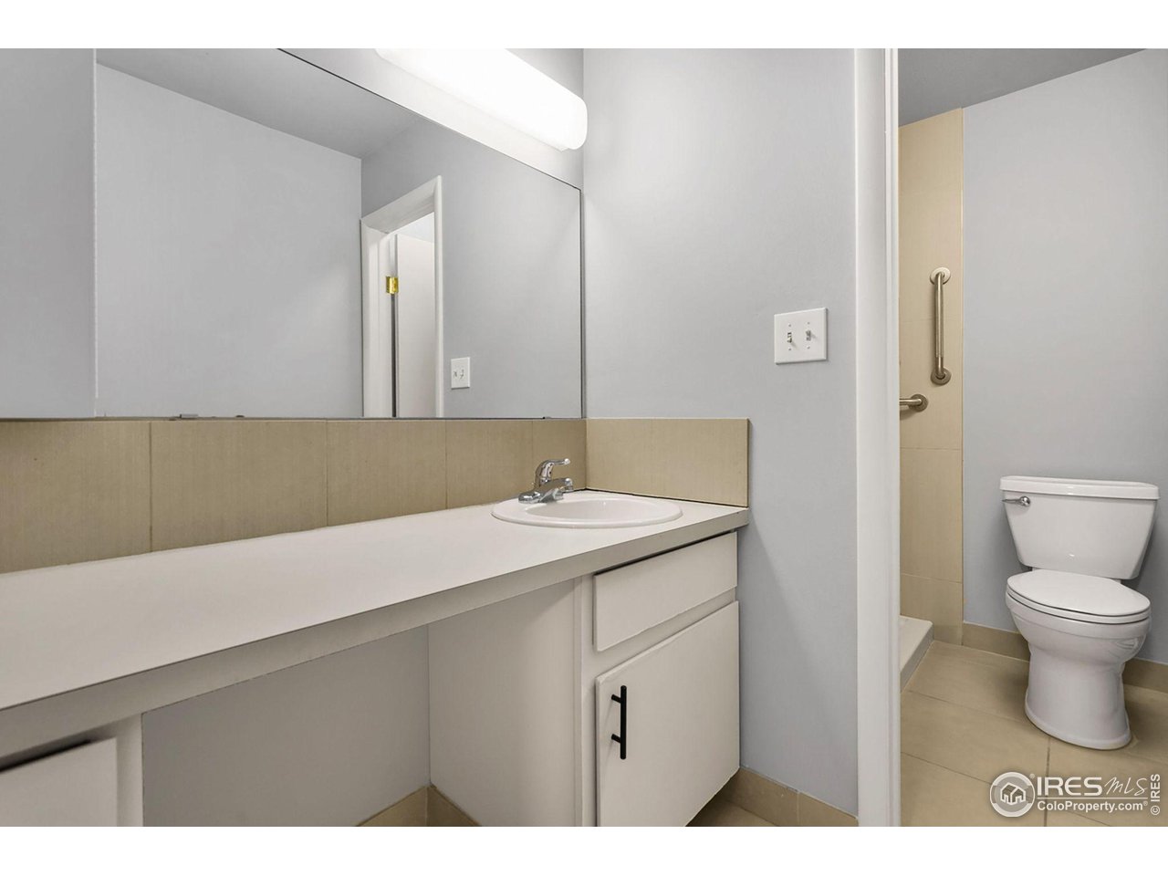 801 East Drake Road, Unit 61 Fort Collins, CO 80525 - Photo 15 of 23 a bathroom with a sink a toilet and a mirror