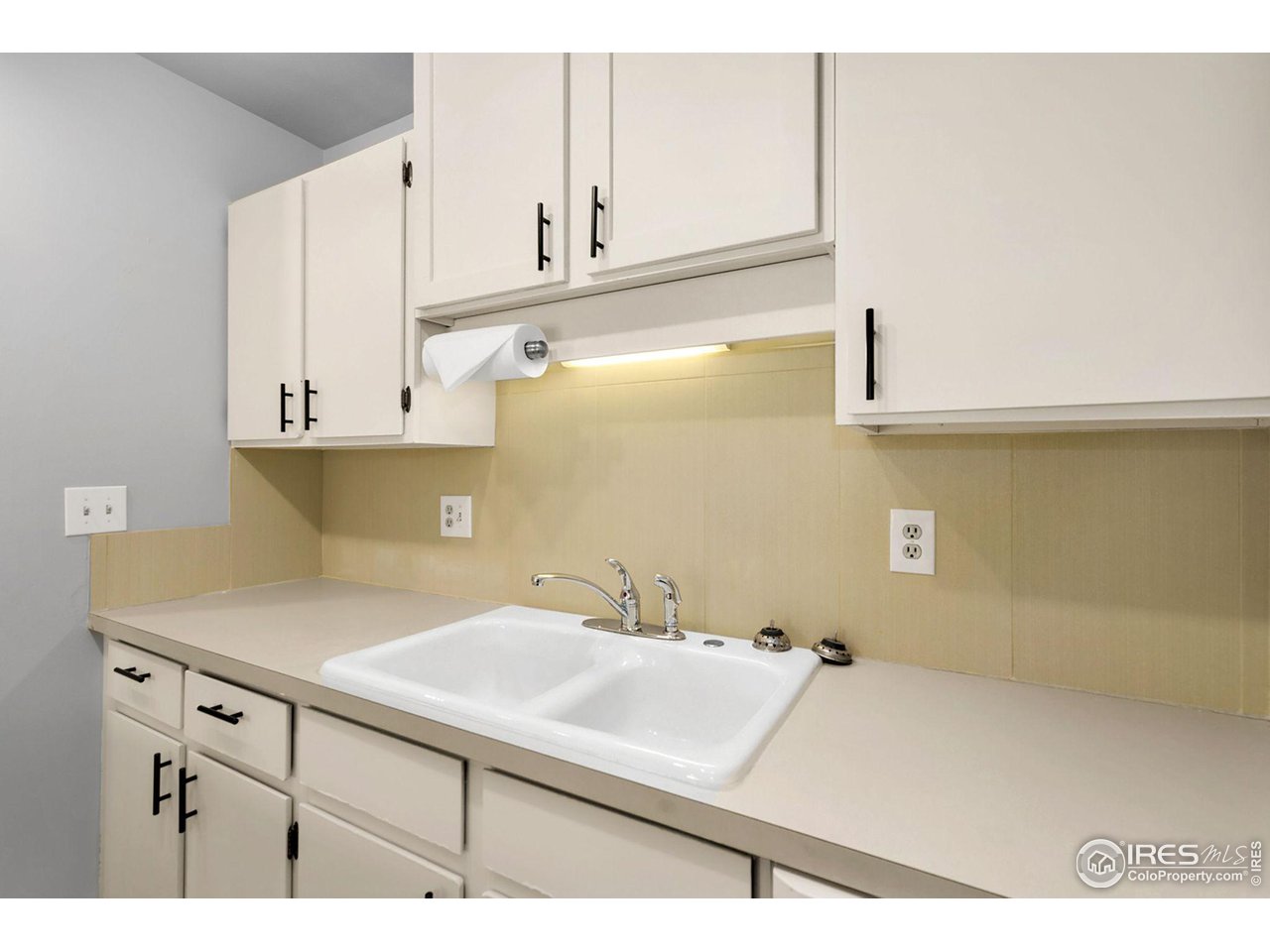 801 East Drake Road, Unit 61 Fort Collins, CO 80525 - Photo 10 of 23 a bathroom with a sink and a white cabinets