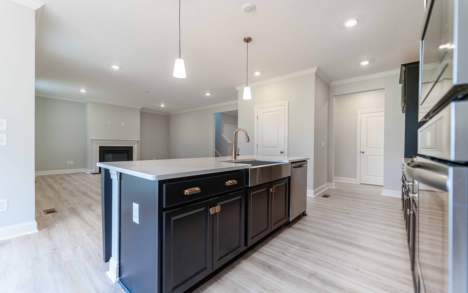 7910 Pine Street Fairview, TN 37062 - Photo 12 of 32 a kitchen with a stove a sink and a refrigerator