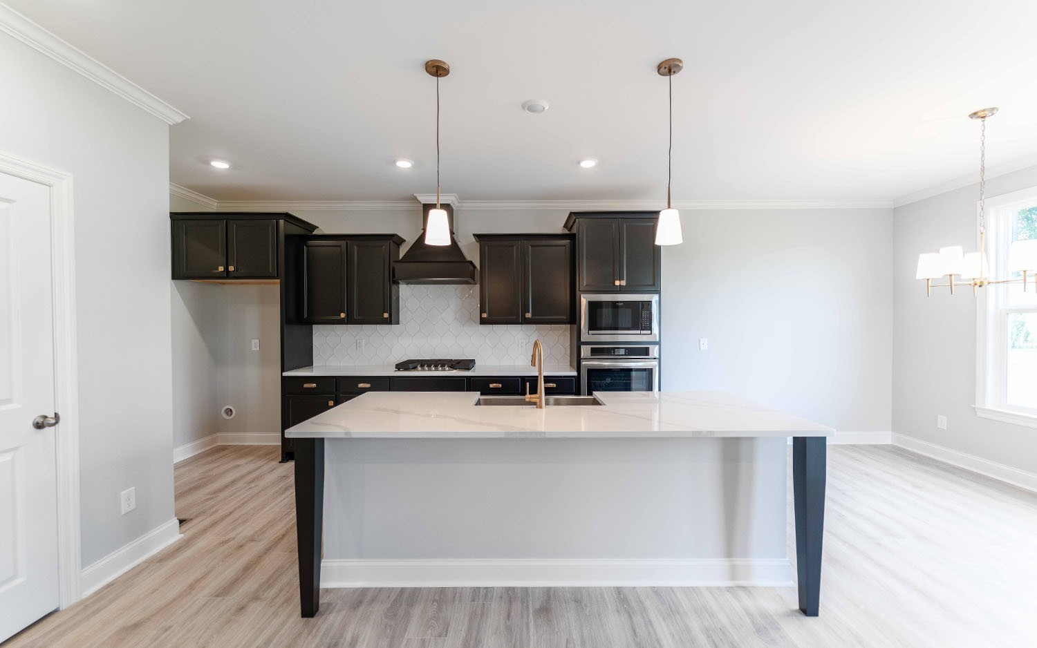 7910 Pine Street Fairview, TN 37062 - Photo 16 of 32 a kitchen with stainless steel appliances a refrigerator sink and microwave