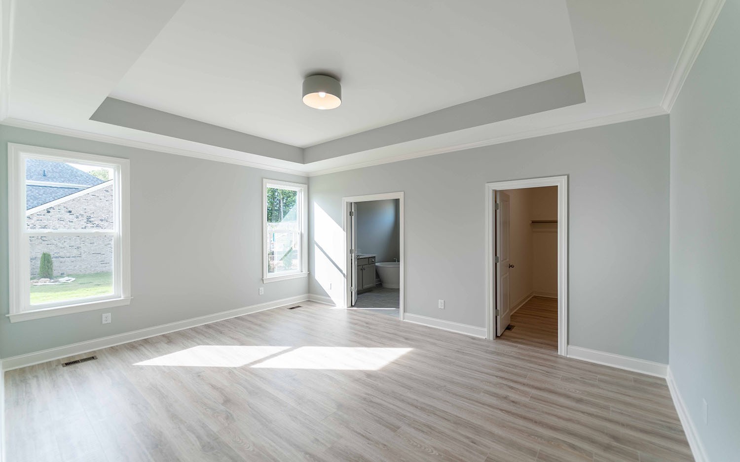 7910 Pine Street Fairview, TN 37062 - Photo 25 of 32 an empty room with wooden floor and windows
