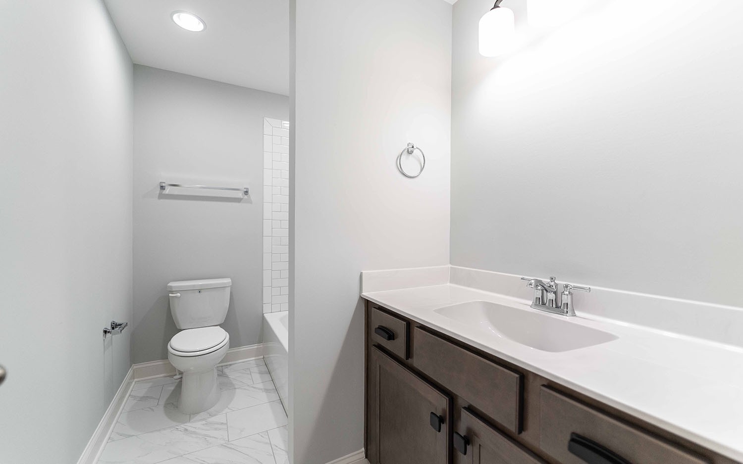 7910 Pine Street Fairview, TN 37062 - Photo 30 of 32 a bathroom with a granite countertop sink a toilet and a mirror