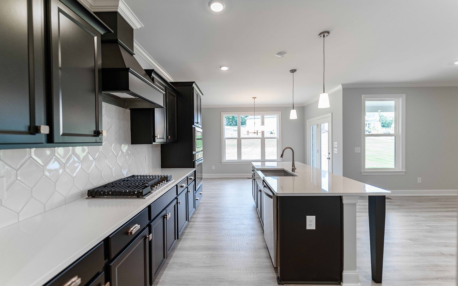 7910 Pine Street Fairview, TN 37062 - Photo 10 of 32 a kitchen with stainless steel appliances granite countertop a sink stove and refrigerator