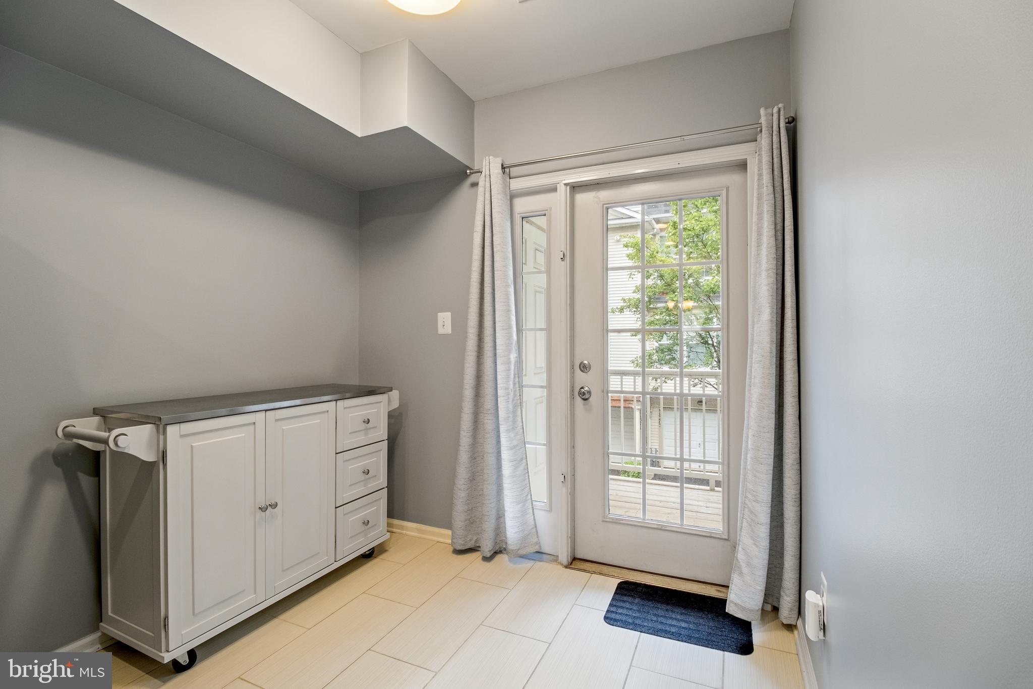 11349 King George Drive, Unit 10 Silver Spring, MD 20902 - Photo 14 of 33 a view of an empty room with a window