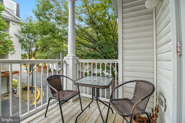 a view of a chair and table in the balcony