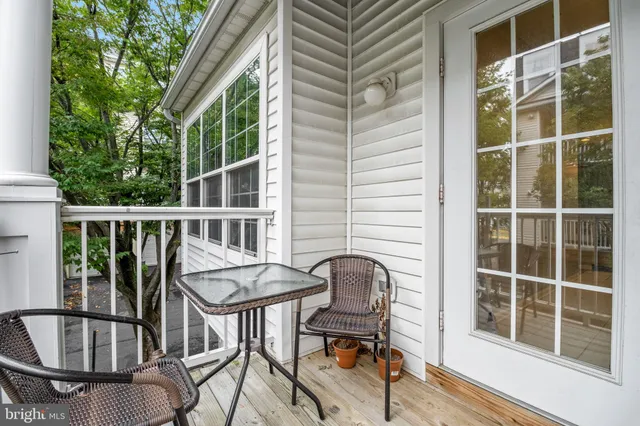 a view of a chair and table in the balcony