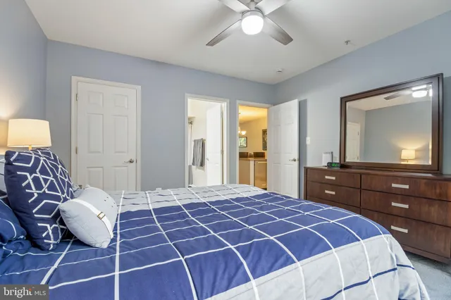 a bedroom with a bed and a dresser