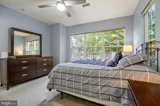 a bed room with a bed and a dresser