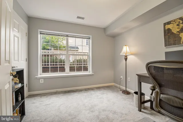 a view of a livingroom with furniture and a window