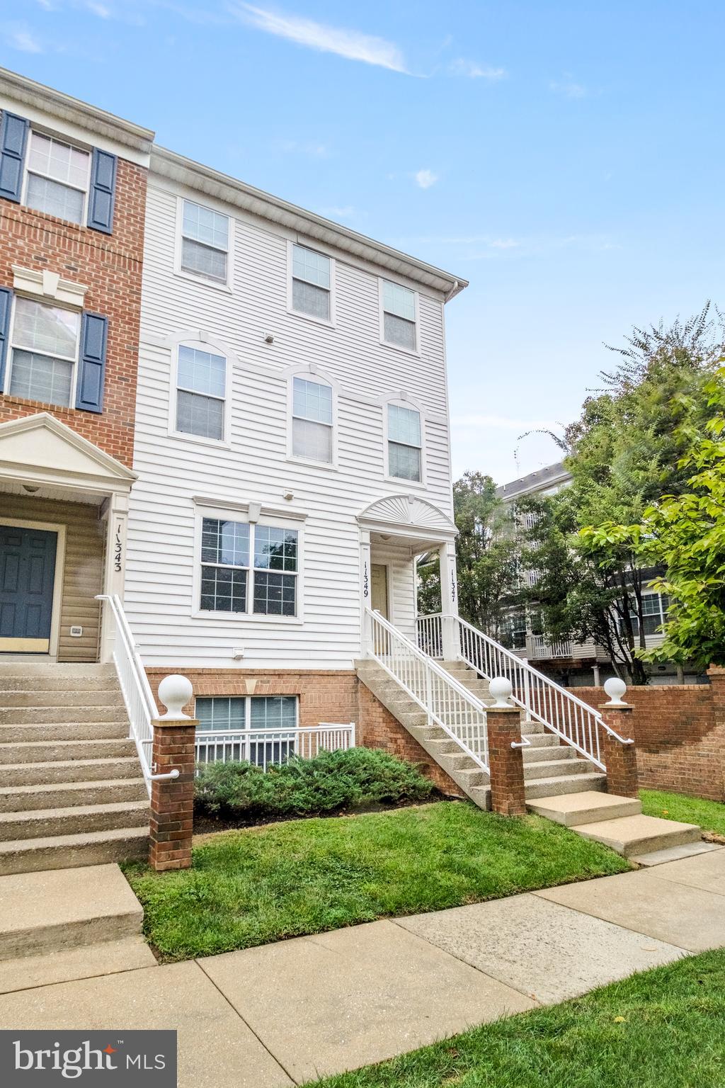 11349 King George Drive, Unit 10 Silver Spring, MD 20902 - Photo 31 of 33 a front view of a house with a yard