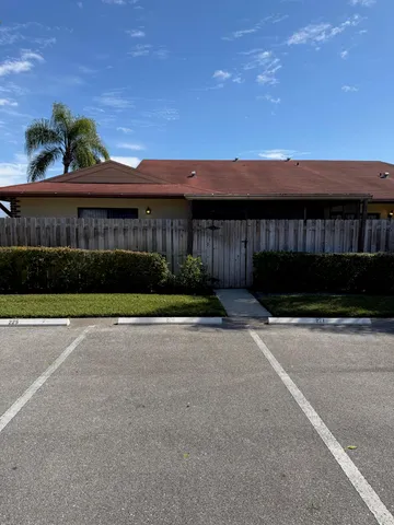 a view of a car park in front of a building