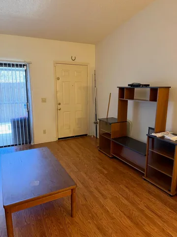 a room with furniture and wooden floor