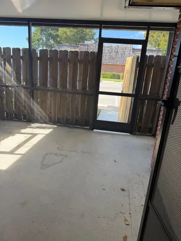 a bedroom with a bed and a mirror