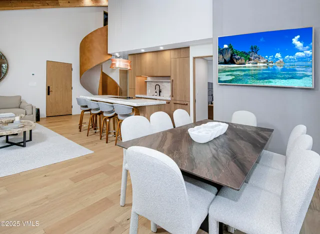 a kitchen with a table and chairs in it