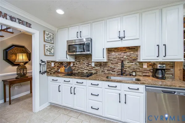 a large white kitchen with lots of counter top space