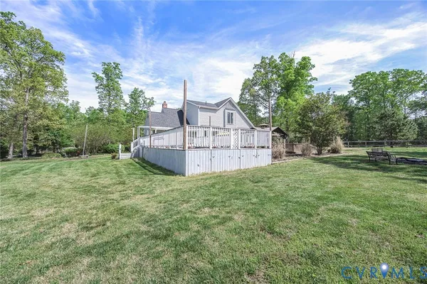 a view of a house with a backyard