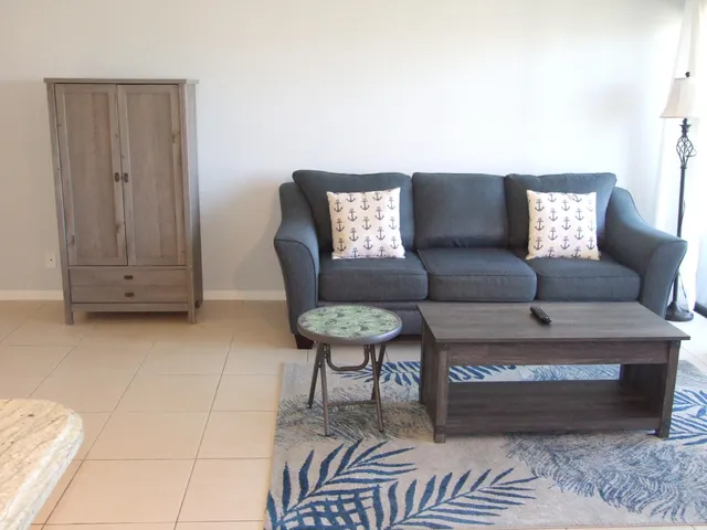 a living room with furniture and a rug