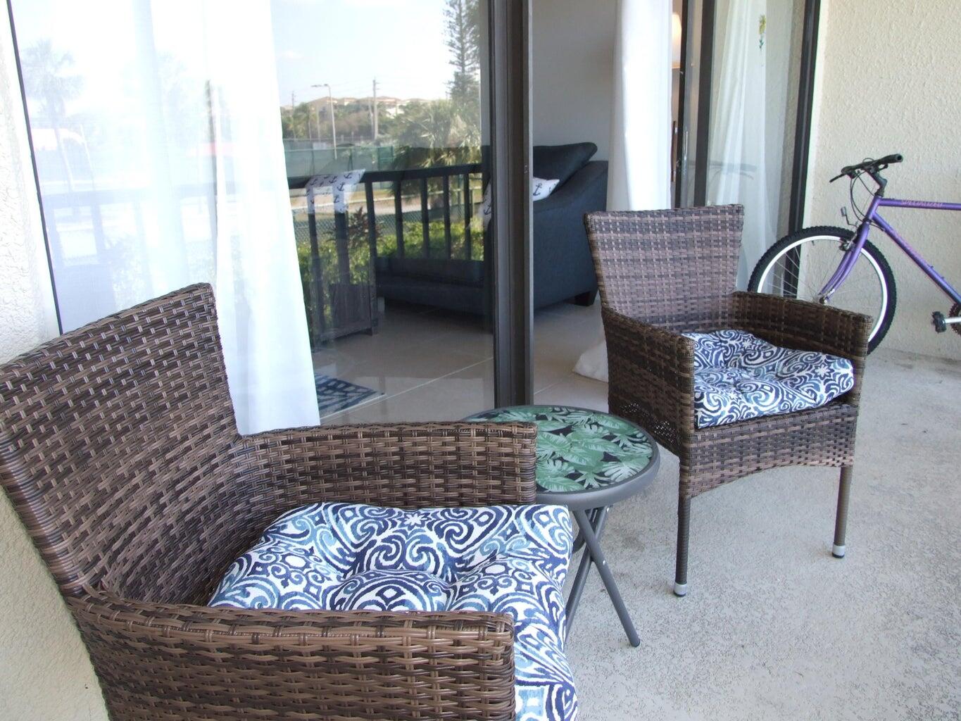 1605 Highway 1, Unit 203 V4 Jupiter, FL 33477 - Photo 14 of 33 a living room with furniture and a rug