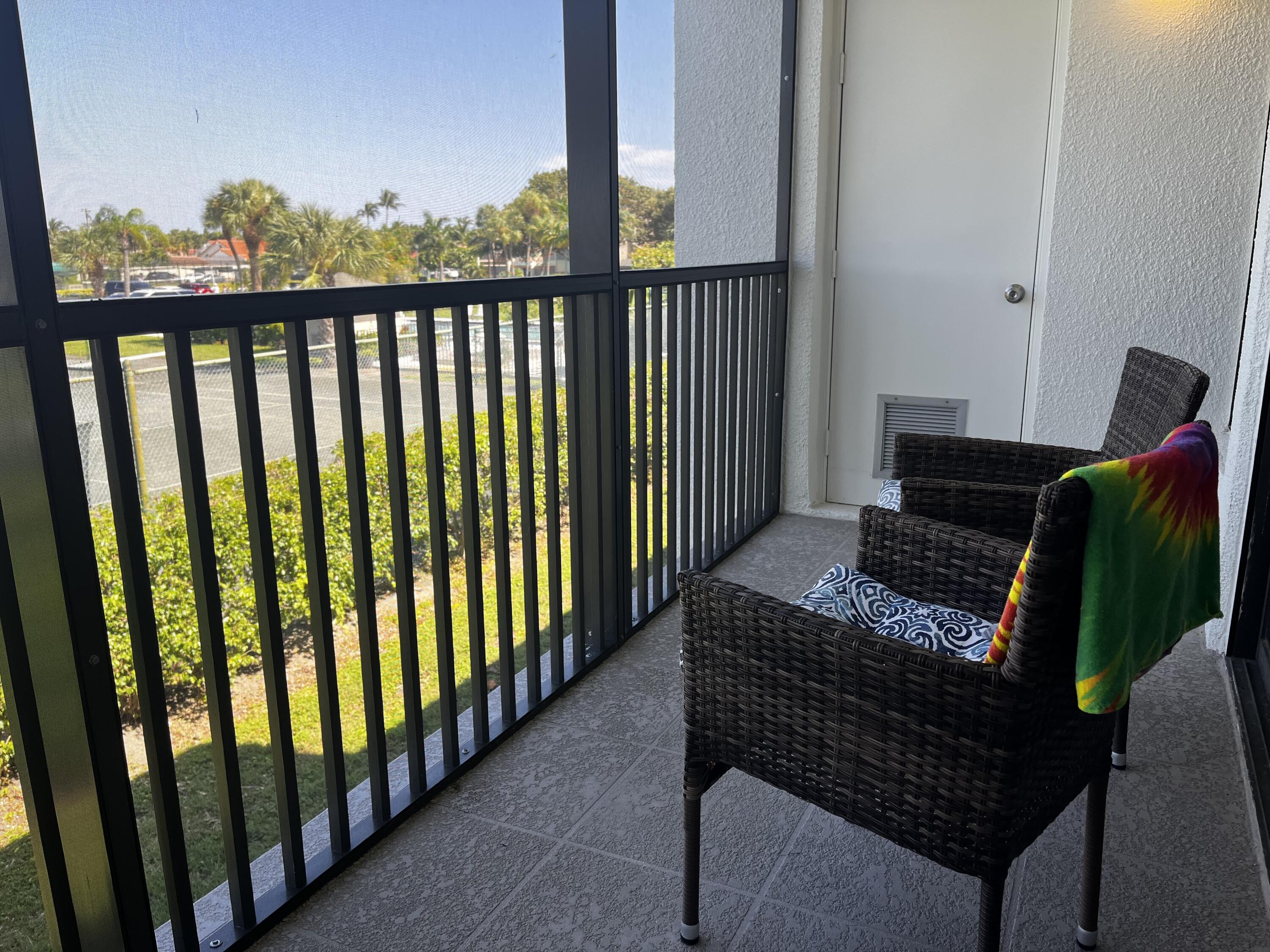 1605 Highway 1, Unit 203 V4 Jupiter, FL 33477 - Photo 16 of 33 a view of a balcony with furniture