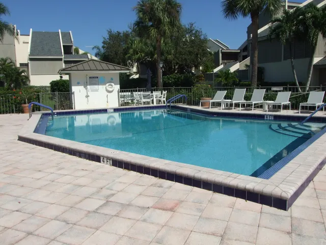 a view of a swimming pool with a patio