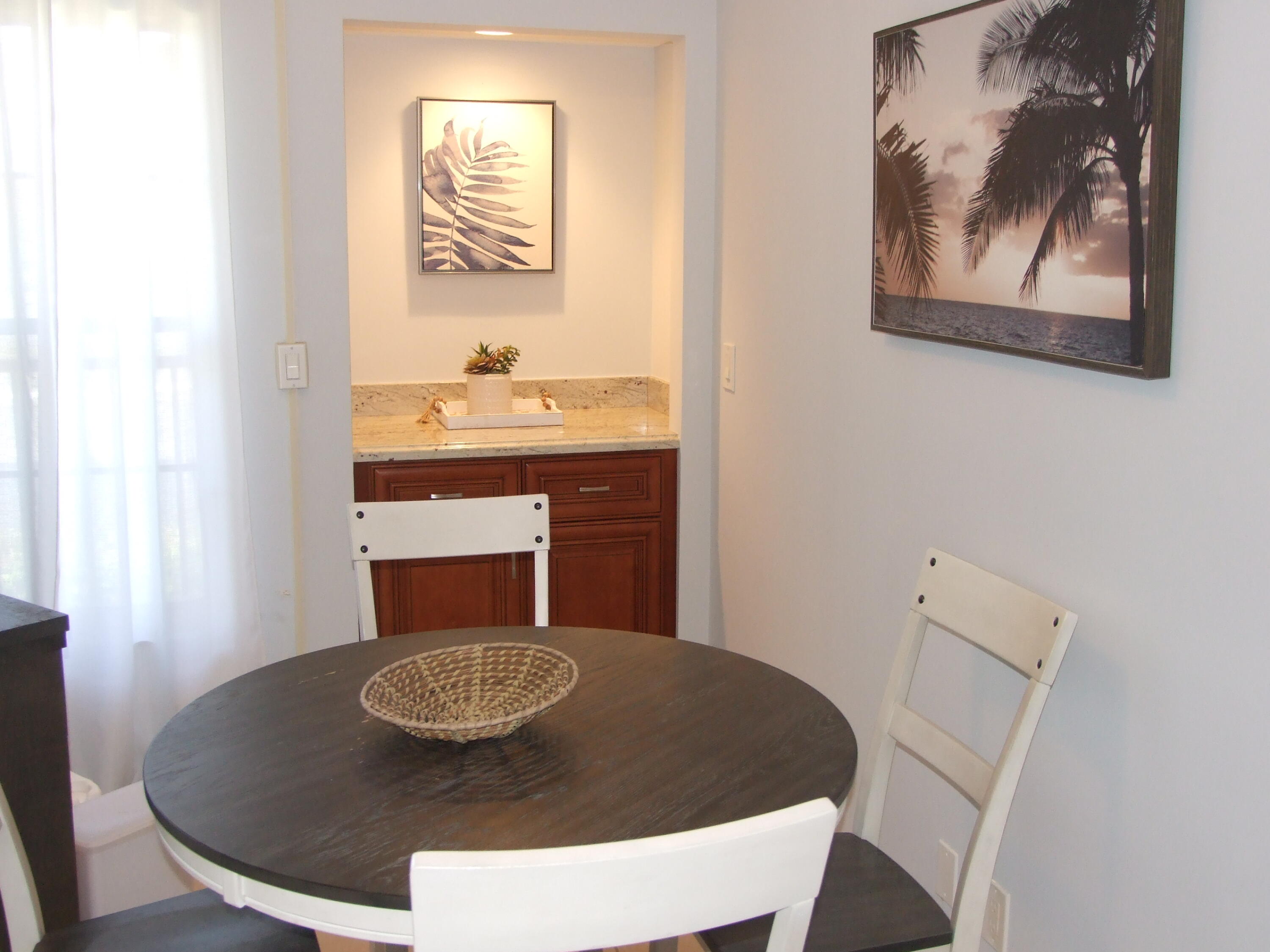 1605 Highway 1, Unit 203 V4 Jupiter, FL 33477 - Photo 7 of 33 a bathroom with a sink and a mirror