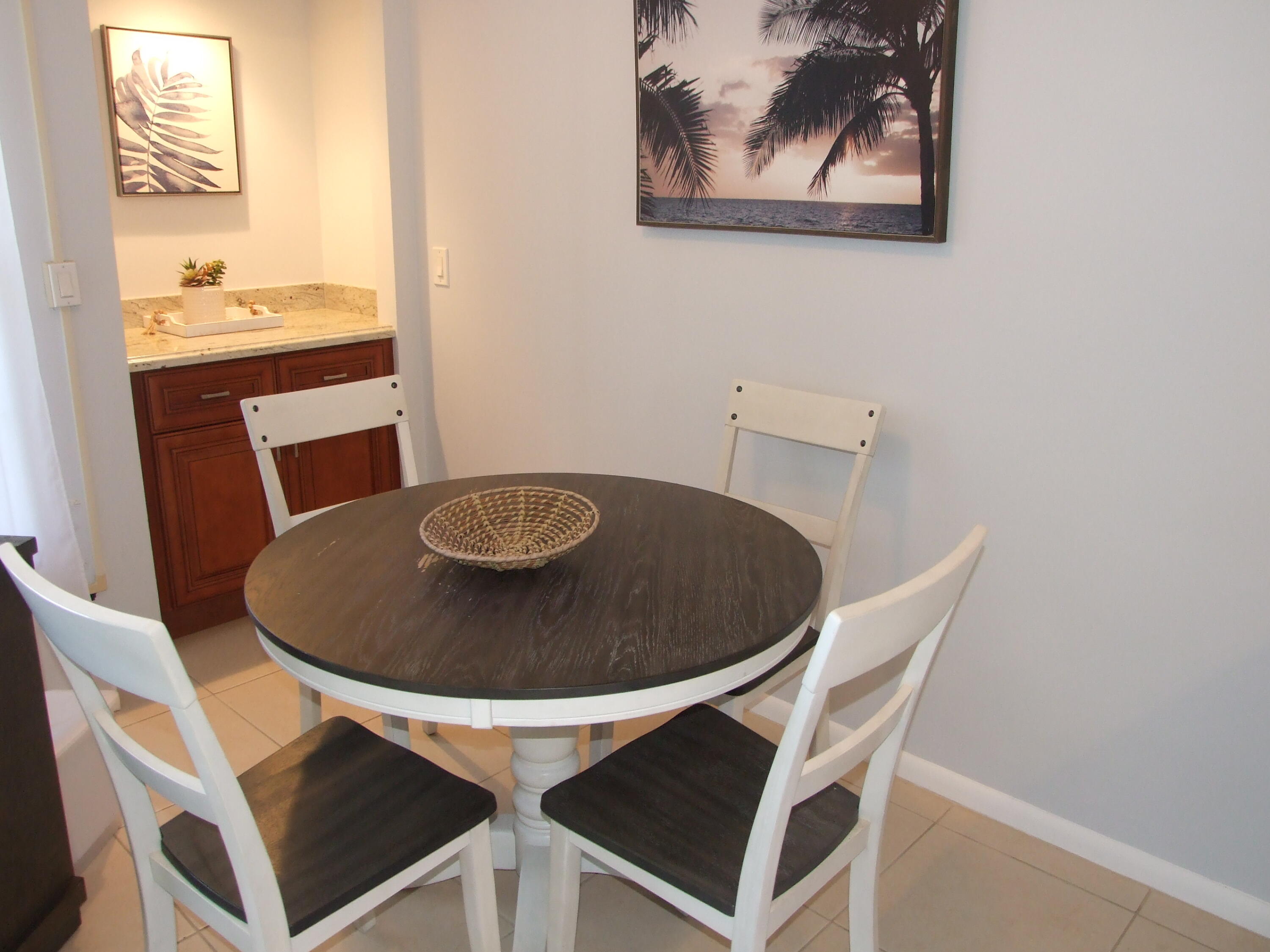 1605 Highway 1, Unit 203 V4 Jupiter, FL 33477 - Photo 9 of 33 a table and chairs in a dining room