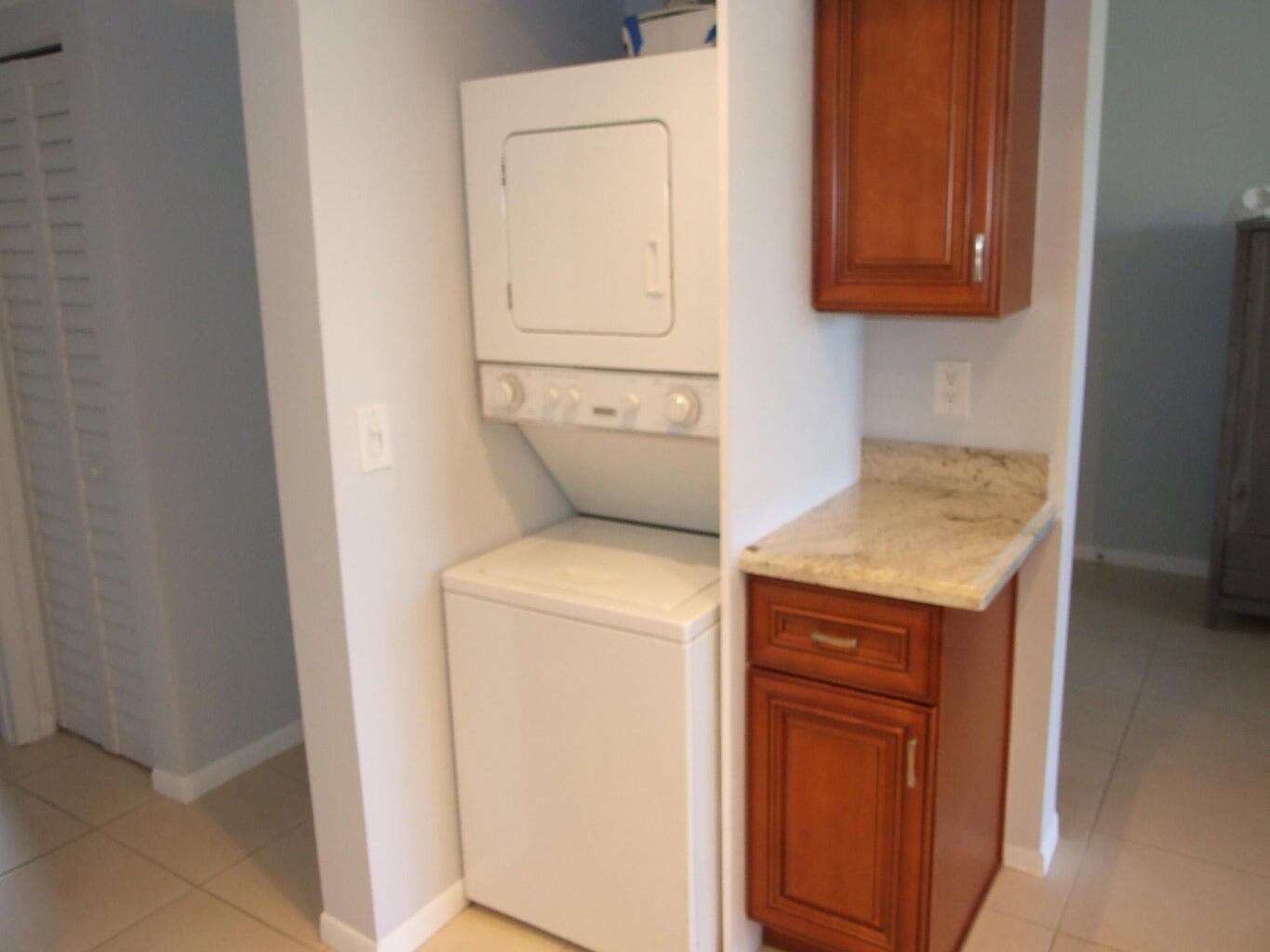 1605 Highway 1, Unit 203 V4 Jupiter, FL 33477 - Photo 10 of 33 a utility room with dryer and washer