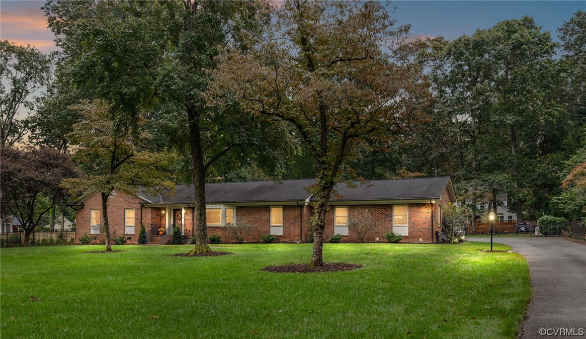 front view of a house with a garden